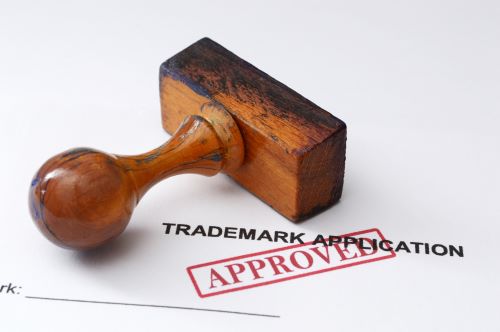 Trademark application with Approved stamp. Austin trademark attorney concept.
